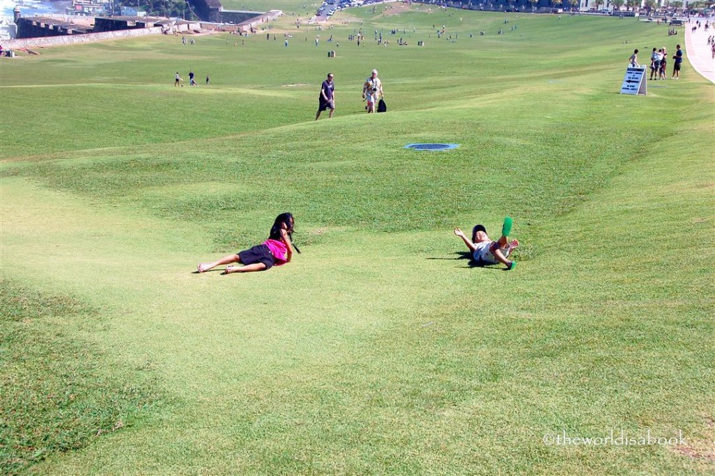 Kids Rolling in the grass at El Morro Puerto Rico 