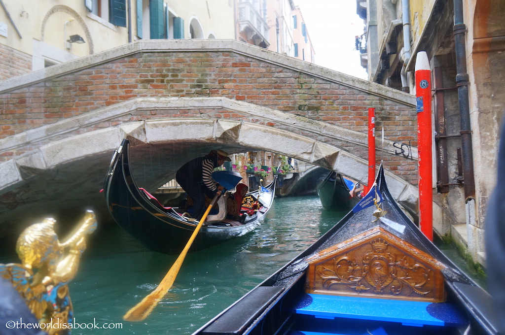 Venice gondola ride under a bridge