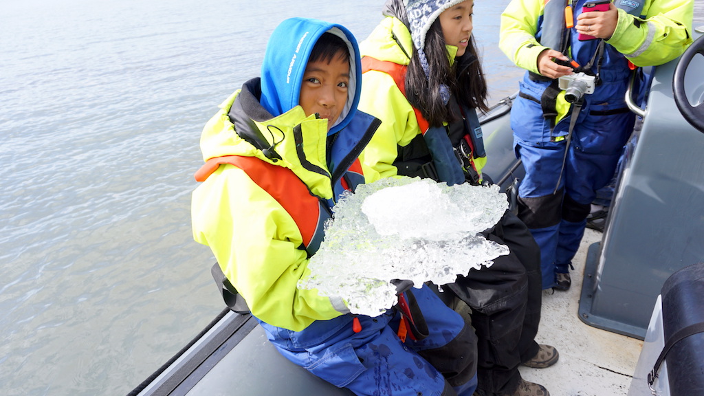 Jokulsarlon Glacier lagoon with kids ice break